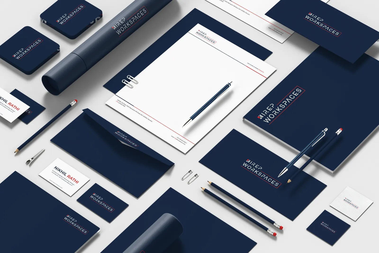 Brand kit flat-lay: folders, letterhead, cards, pens and notebooks